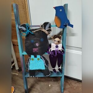 Adorable handmade little animals on a ladder